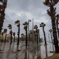 Strong winds and stormy weather hit a coastal promenade in Spain