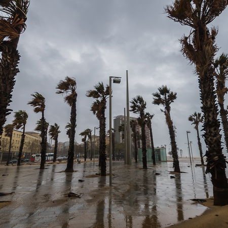 Strong winds and stormy weather hit a coastal promenade in Spain