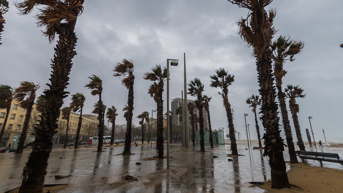 Strong winds and stormy weather hit a coastal promenade in Spain