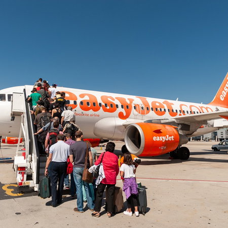 Passengers boarding an easyJet flight from the UK to Spain on the runway