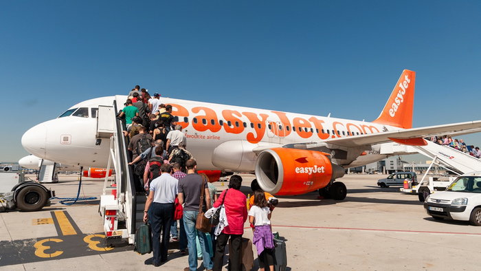 Passengers boarding an easyJet flight from the UK to Spain on the runway