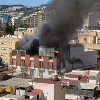 Blazing hotel roof after explosion.