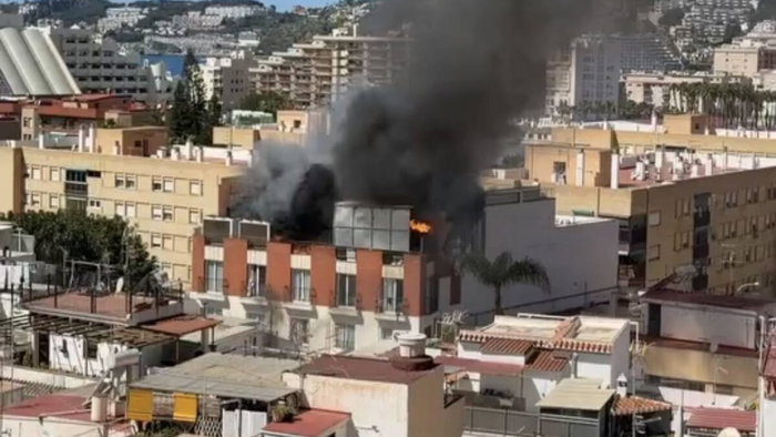 Blazing hotel roof after explosion.