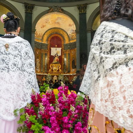 V16 emergency warning light flashing on top of a car stopped on the roadside in Spain.