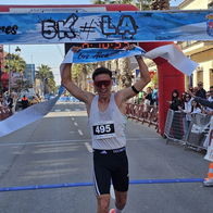 Runners competing in the Los Alcazares 5K race along the Mar Menor coastline