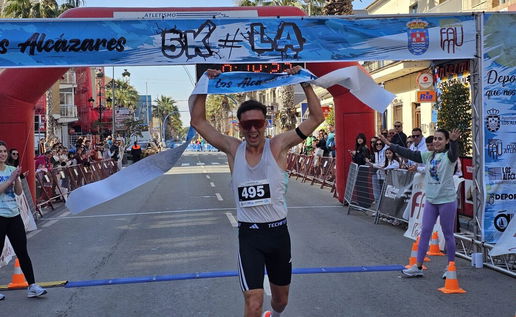 Runners competing in the Los Alcazares 5K race along the Mar Menor coastline
