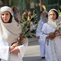 Children holding olive branches during Palm Sunday procession in San Pedro del Pinatar