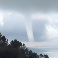 Tornado-like waterspout forming over the Mediterranean Sea off the coast of Zoagli in Liguria, Italy