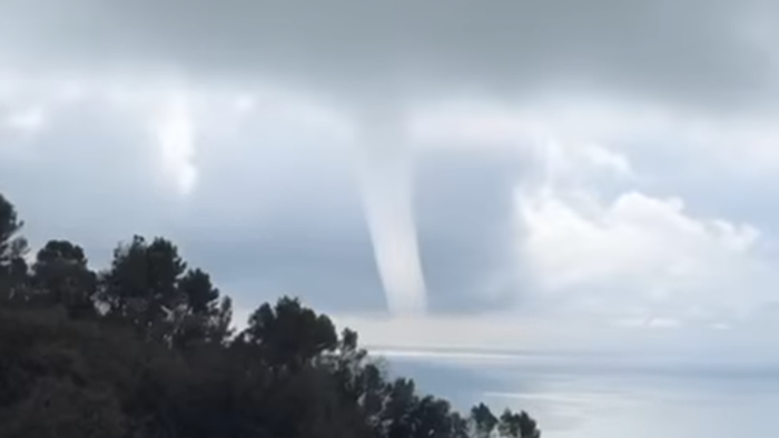 Tornado-like waterspout forming over the Mediterranean Sea off the coast of Zoagli in Liguria, Italy