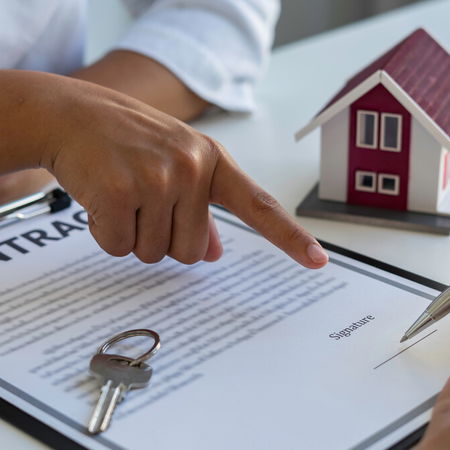 Tenant and landlord signing rental contract in Spain amid proposed 2 percent rent cap