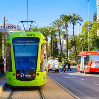 Public bus operating in Murcia city centre during holiday period