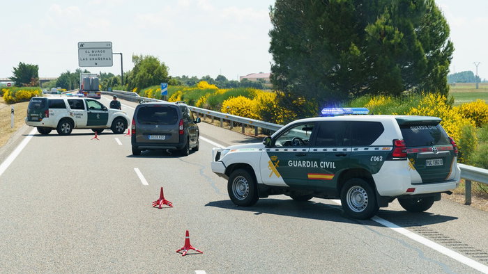 Guardia Civil vehicles driving through traffic on a Spanish motorway during Easter