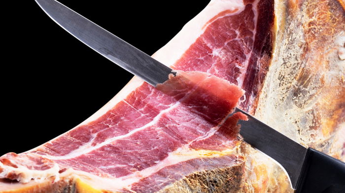 Serrano ham being carved