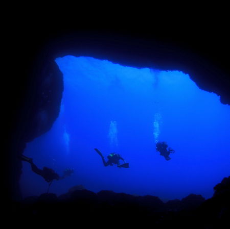Divers in an underwater cave