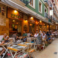 Diners eating out on a terraza in Spain
