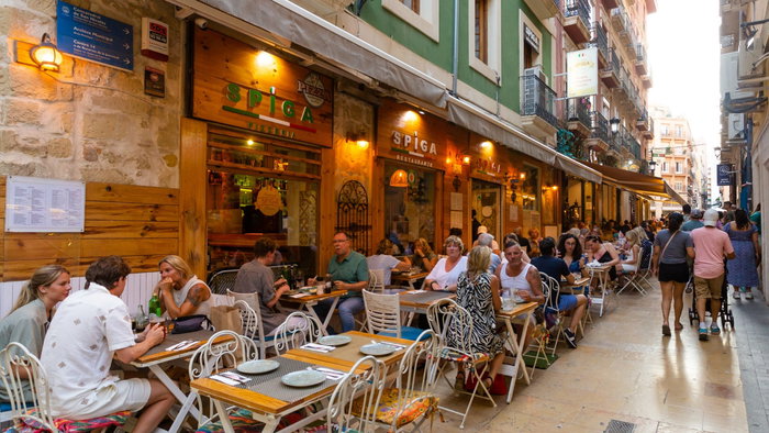 Diners eating out on a terraza in Spain