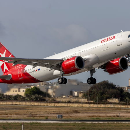 V16 emergency warning light flashing on top of a car stopped on the roadside in Spain.