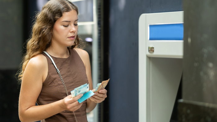 Woman withdrawing cash from an ATM