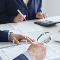 Tax inspector reviewing financial documents during an audit