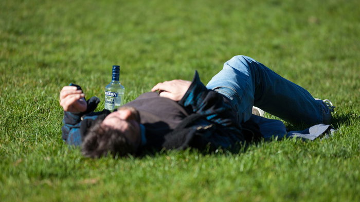 A man drunk on the grass.