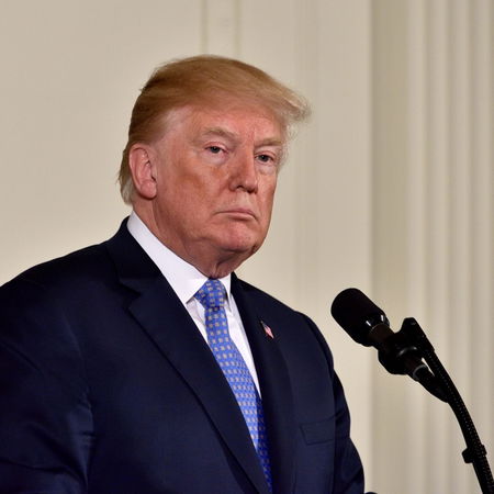 Donald Trump speaking at a press conference amid rising tensions with Spain over NATO and military bases