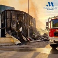 Despite the efforts of firefighters, the factory still burns.