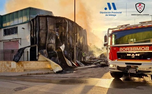 Despite the efforts of firefighters, the factory still burns.