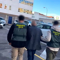 Pinched! Suspect led away by Guardia Civil officers.