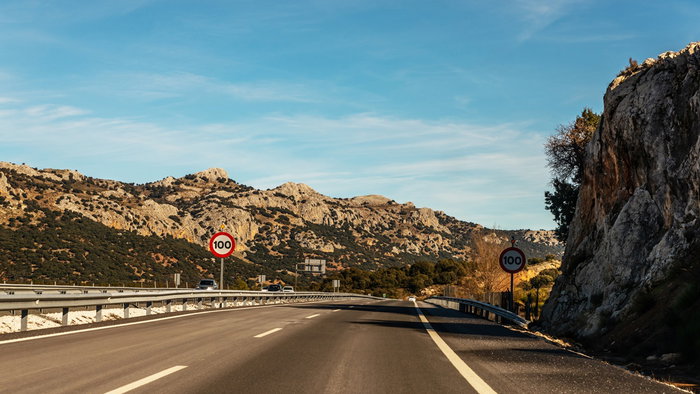 100 kmh speed limit signs on a Spanish motorway through a mountainous area