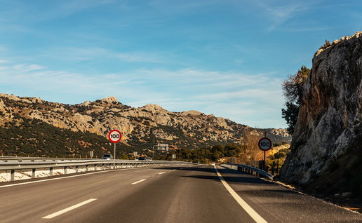 100 kmh speed limit signs on a Spanish motorway through a mountainous area