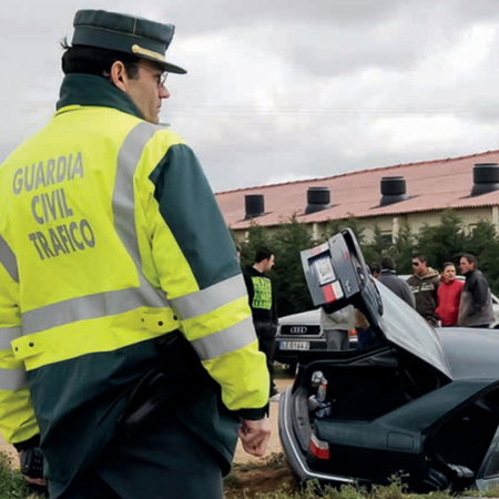 Guardia Civil officer at scene of car crash after vehicle left the road in Spain