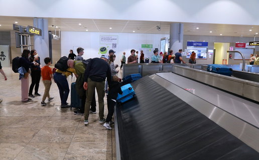 Passengers collecting luggage inside Alicante Airport as new fast track check-in service is expected before summer