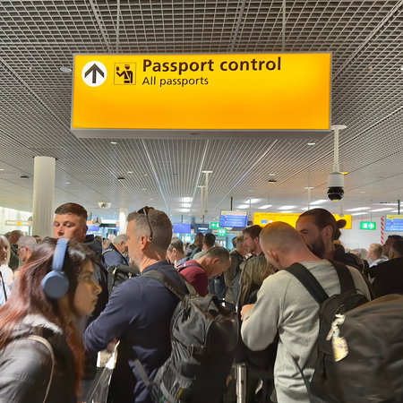 Crowded passport control queue at European airport after new border system