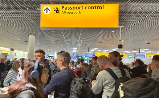 Crowded passport control queue at European airport after new border system