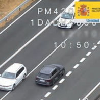 Car overtaking cyclists without safe distance on Spanish road captured by DGT aerial camera