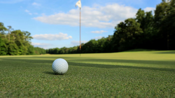 Golf ball on top of a green