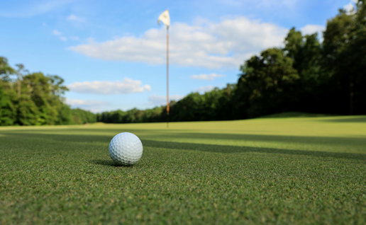 Golf ball on top of a green
