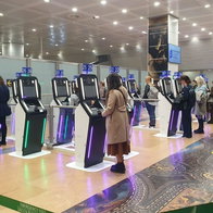 Passengers using the new EES machines.