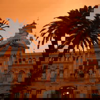Malaga Town Hall drenched with mud rain in 2022.