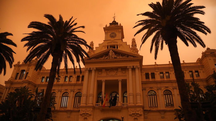 Malaga Town Hall drenched with mud rain in 2022.