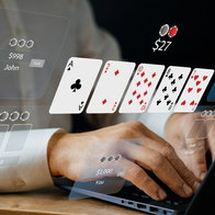 Man playing poker online via a laptop