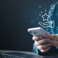 A person using a mobile phone to redeem coupon voucher