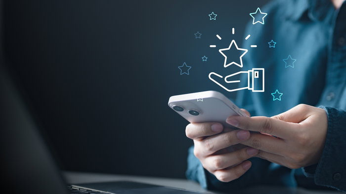 A person using a mobile phone to redeem coupon voucher