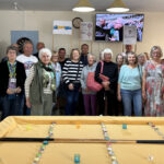 Cheques of compassion: ACE Estepona delivers Grand National friendship and joy and a year’s fundraising to local charities