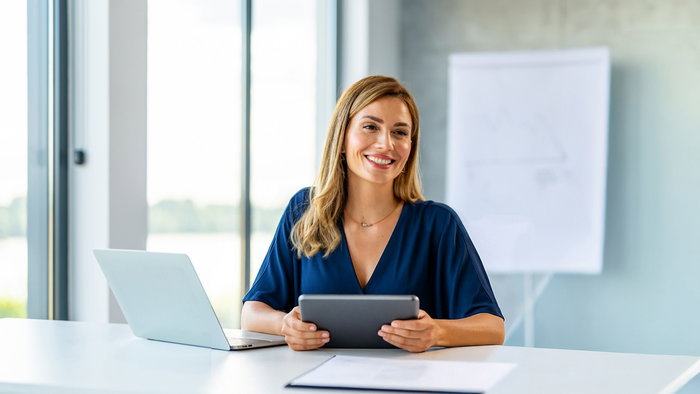 Woman sitting at a desk.