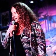 Comedian Lucy Aman performs comedy