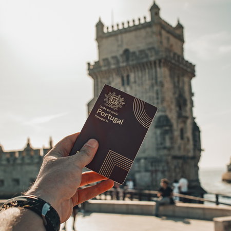 Person holding a Portuguese passport in Lisbon as Portugal prepares tougher long stay visa rules