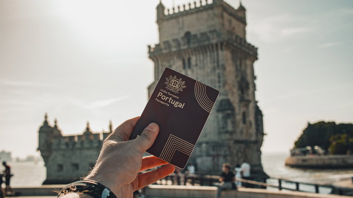 Person holding a Portuguese passport in Lisbon as Portugal prepares tougher long stay visa rules