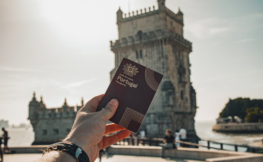 Person holding a Portuguese passport in Lisbon as Portugal prepares tougher long stay visa rules