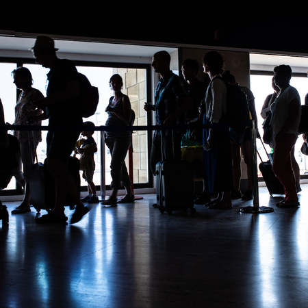 People in a queue for passport control at an airport